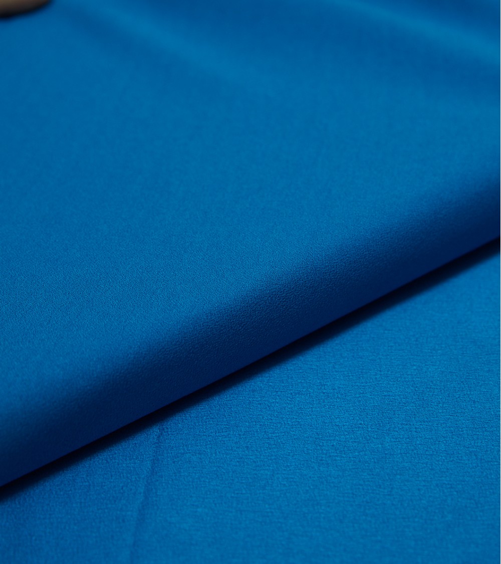 Blue crepe-effect viscose satin fabric