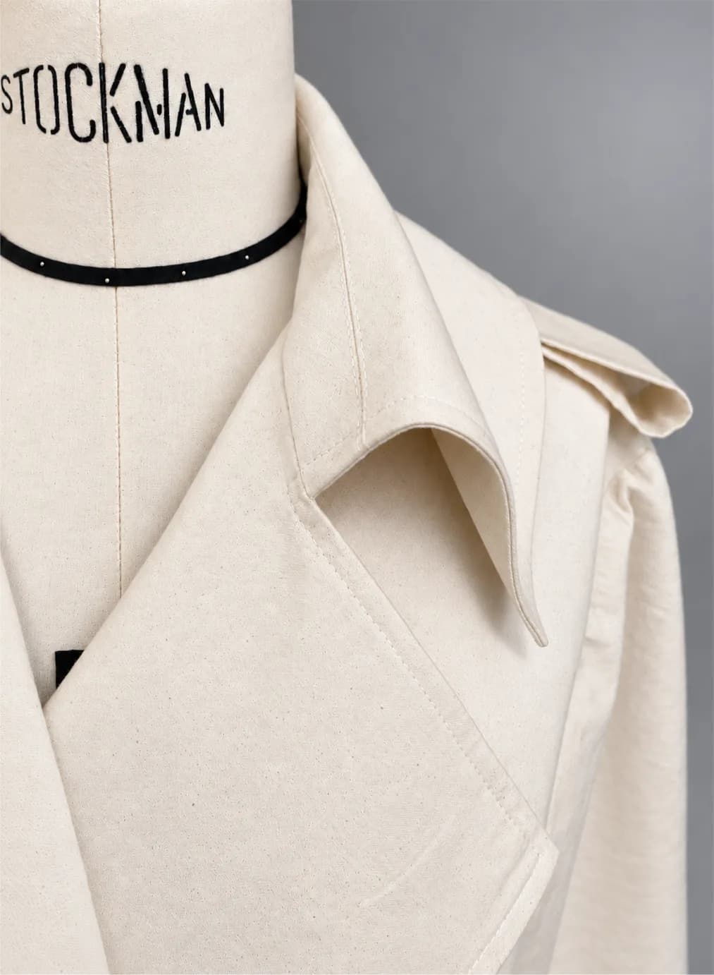 A trench coat collar in unbleached calico on a Stockman bust