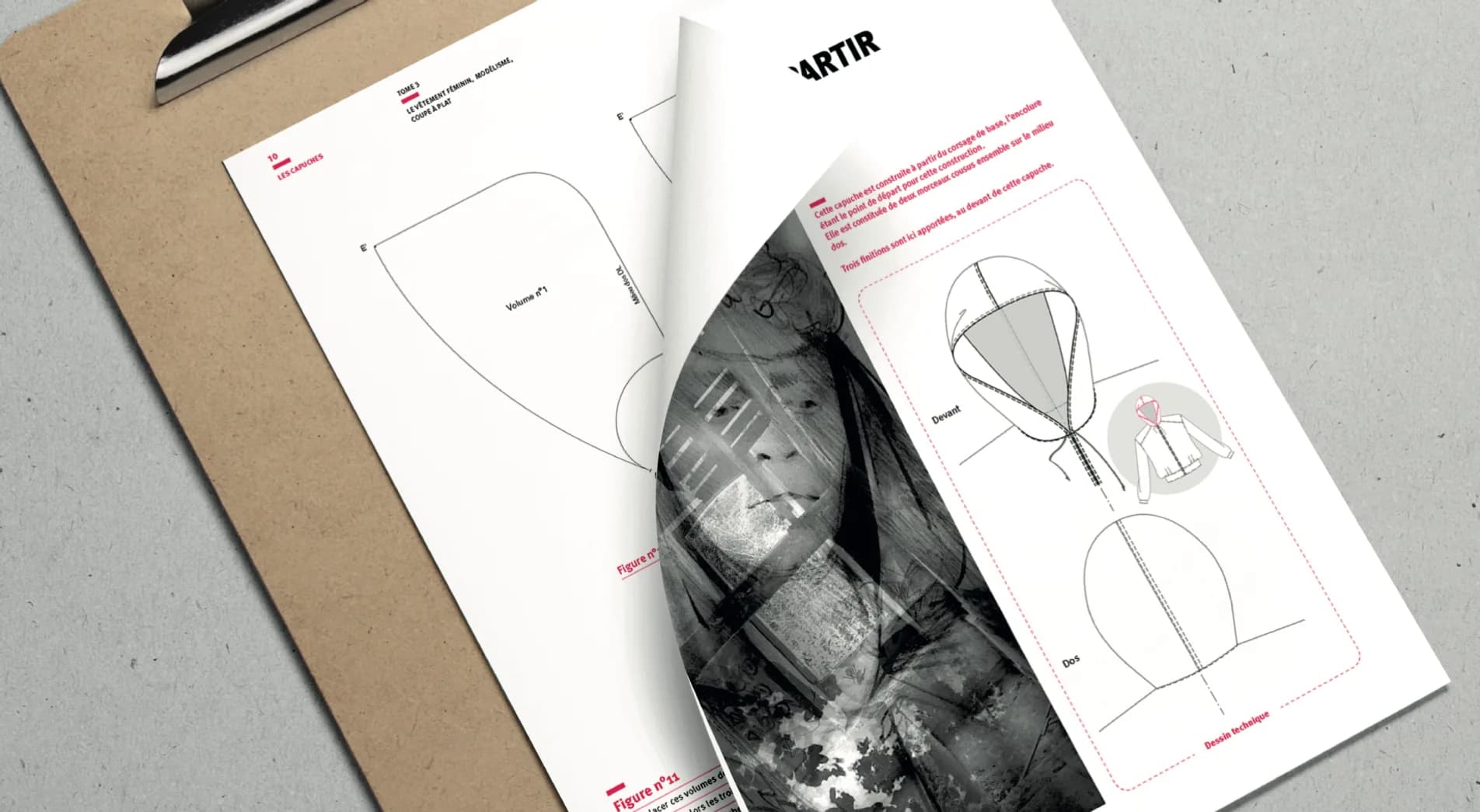 A technical file on a clipboard, in close-up: the draft of a hood and its technical drawing